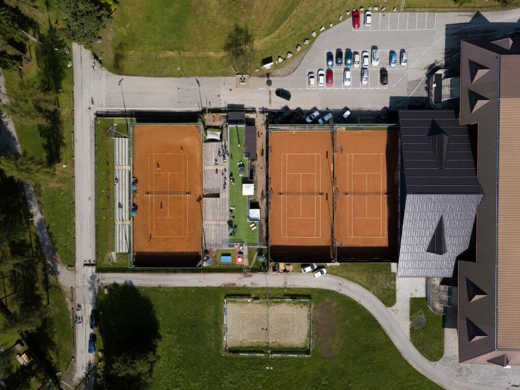 Aerial view of Tennis Club Pinzolo tennis courts with the Brenta Dolomites